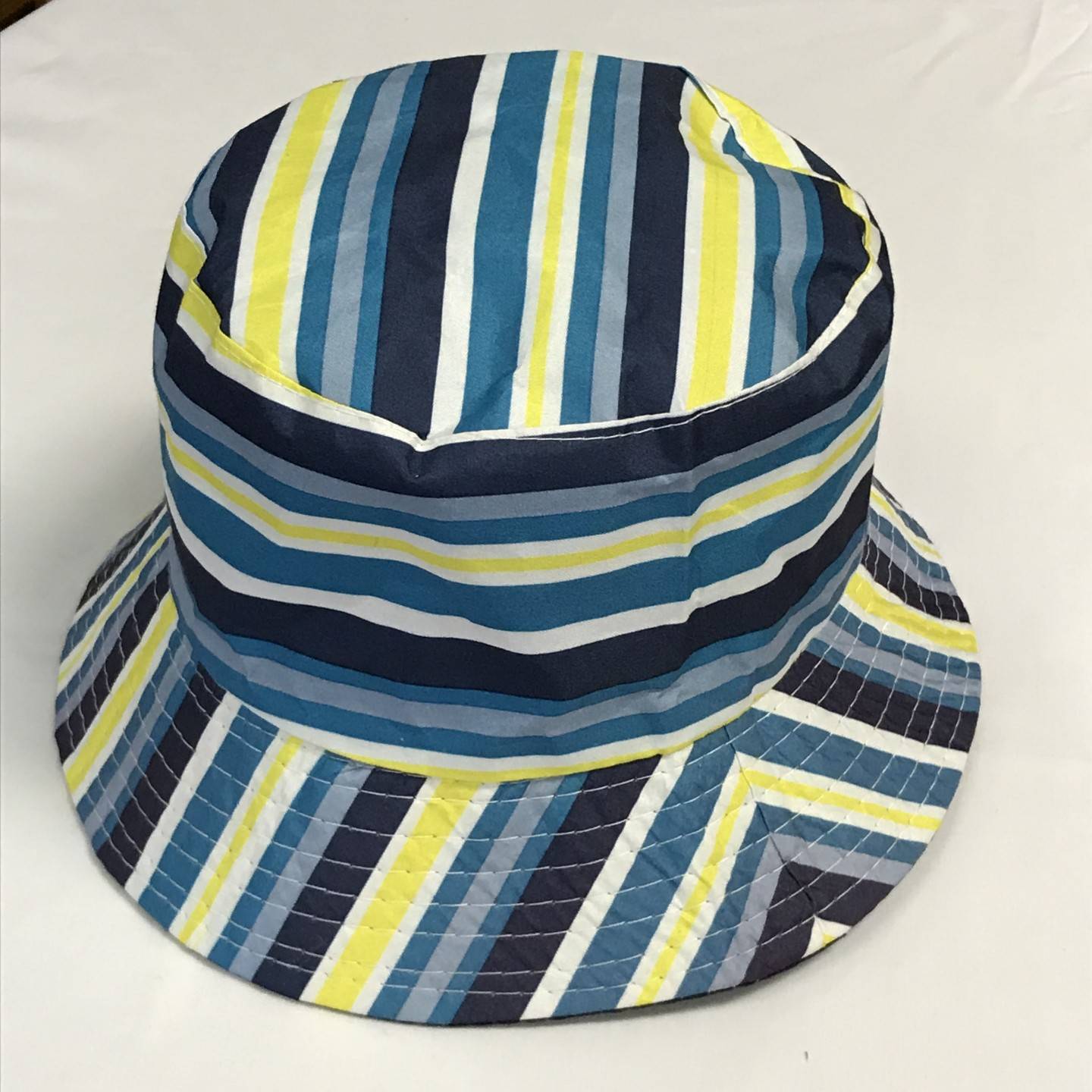 BLUE AND YELLOW REVERSIBLE BUCKET HAT AGES 12+